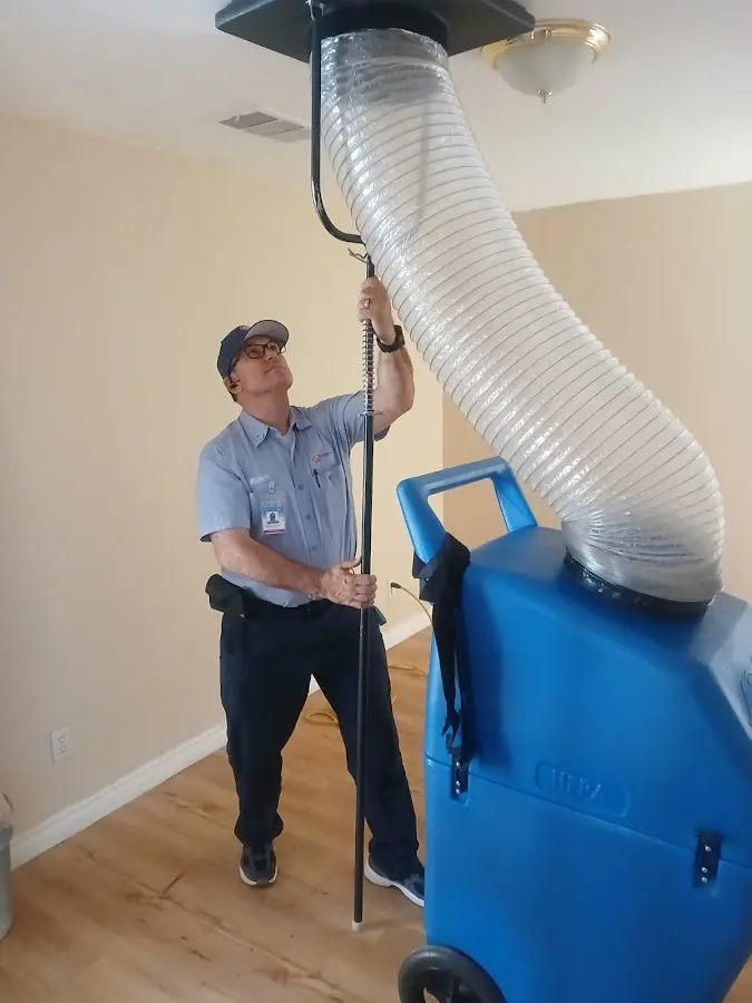 Furnace Tune-Up technician using HEPA equipment in Columbia
